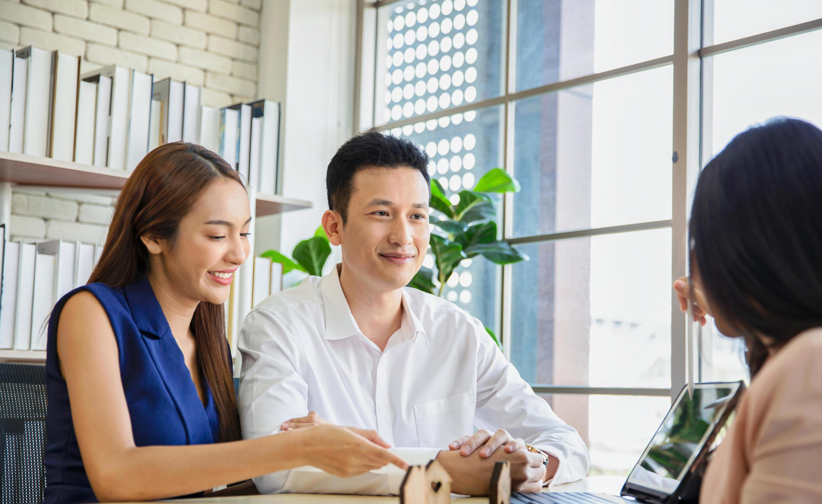 Couple meeting with real estate advisor