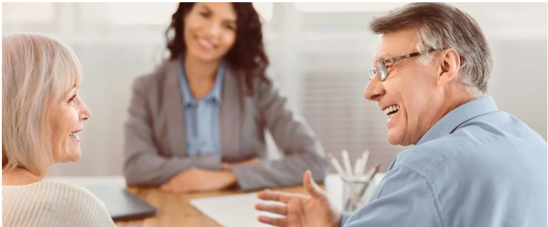 Couple meeting with real estate advisor